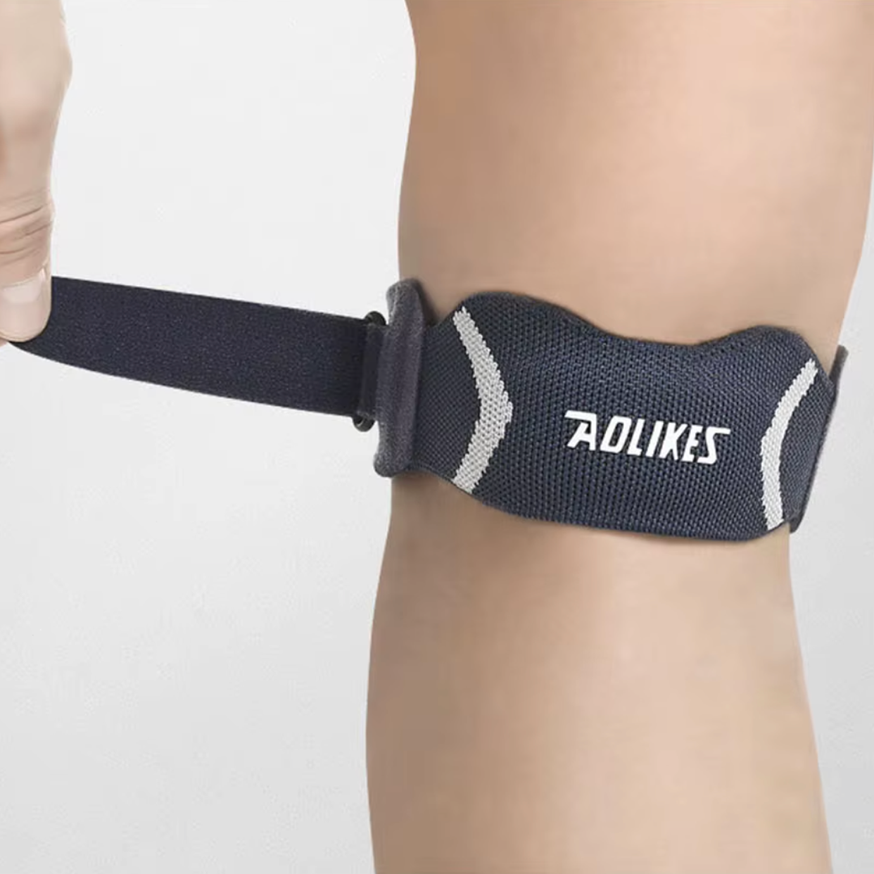 Strap genou rotulien réglable à coussinet